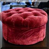 F85. Tufted burgundy ottoman. 